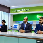 Home 23 타지키스탄의 경제 개혁 정책 - A modern Tajikistani bank interior showing diverse small and medium business owners, including men a...